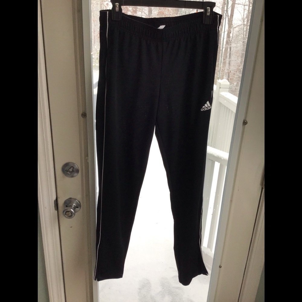 Adidas warm up pants that zip up at bottom unisex size M